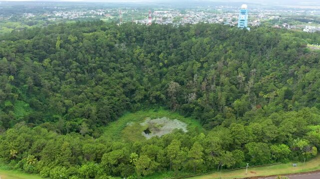 Aerial top view perspective of Trou Aux Cerf Volcano Curepipe in the tropical island jungle of Mauritius. Aerial view of Trou aux cerfs dormant volcano located at Curepipre, Mauritius