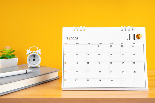 July desk calendar for 2026 year on work table.