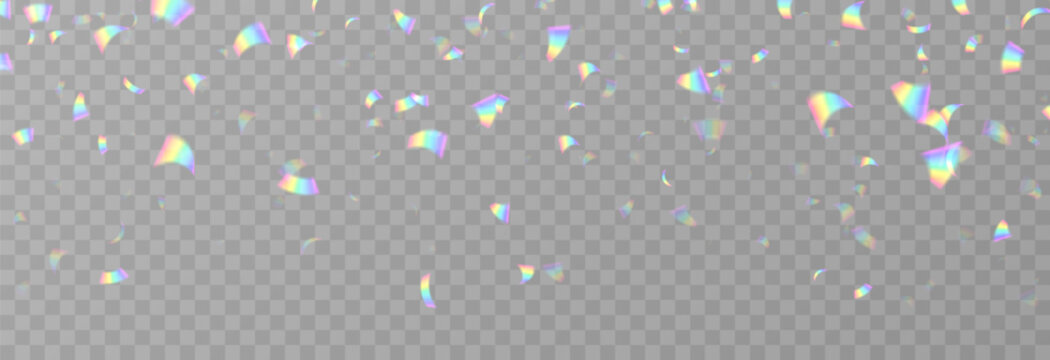 Falling holographic confetti. Shiny rainbow confetti PNG. Falling streamers or tinsel on an isolated transparent background.