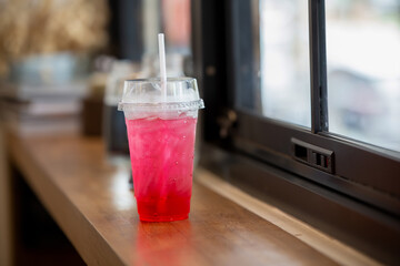 soft drink pinks color on counter bar by windows
