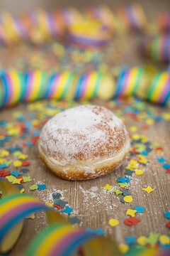 Pastry for carnival celebration with streamers and confetti