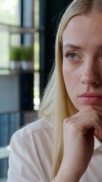 Caucasian female business manager professional woman businesswoman thinking idea think hard difficult question young girl looking away holding chin confuse puzzled consider creative strategy in office