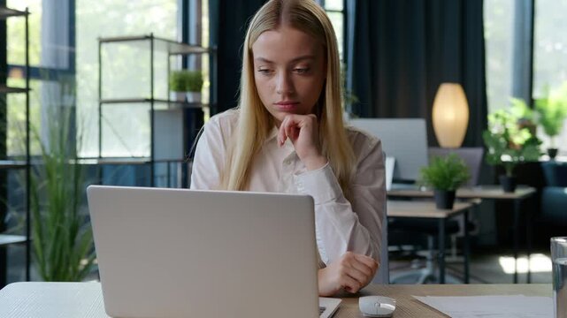 European thoughtful businesswoman Caucasian girl business woman come up with idea typing laptop thinking decision solution online work computer browsing at table in office female entrepreneur hesitate