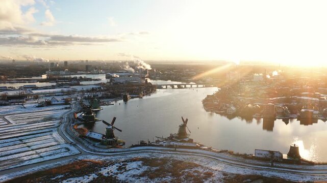 Zaanse schans windmills during a snowy winter sunrise
