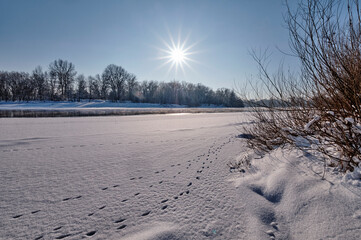 Frosty day by the river in winter.