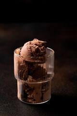 chocolate ice cream balls in a clear glass