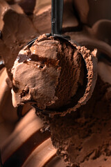 Scooped chocolate ice cream or chocolate ice cream background