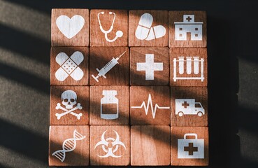 Medical Services and Healthcare Concept – Grid of Blocks with Engraved Icons for Health, Safety, and Treatment, healthcare, medical, health, hospital, emergency, treatment, safety, medicine, biohazard