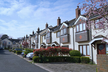 Modern suburban row houses with parking in front