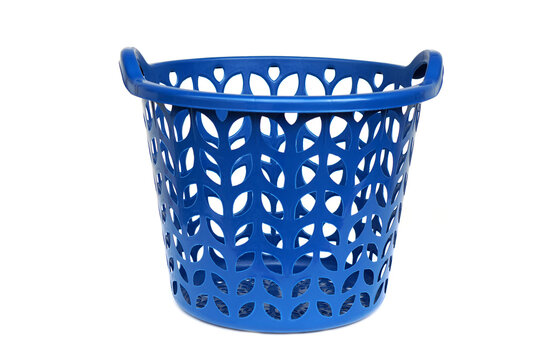 Blue plastic laundry basket isolated on white background with perforated design and side handles. Concept of household storage, laundry organization, cleaning routine, home utility 