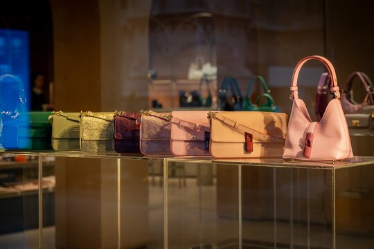 Milan, Italy - 2026, 13 Jan: Elegant Furla FW25 handbags in vibrant colors and premium leather, beautifully displayed in a chic Milan boutique, highlighting luxury and style