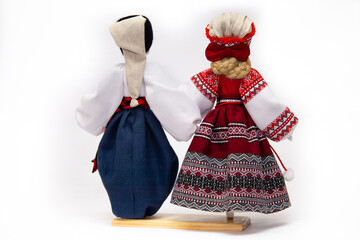 The Ukrainian motanka doll is an ancient amulet and symbol of Ukrainian culture, made without a face so as not to instill a soul in it. Instead of a face, a cross is often dangled to protect against e