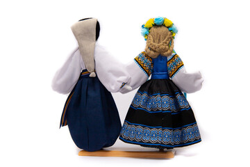 The Ukrainian motanka doll is an ancient amulet and symbol of Ukrainian culture, made without a face so as not to instill a soul in it. Instead of a face, a cross is often dangled to protect against e