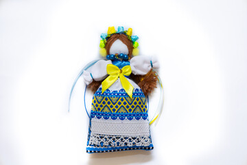 The Ukrainian motanka doll is an ancient amulet and symbol of Ukrainian culture, made without a face so as not to instill a soul in it. Instead of a face, a cross is often dangled to protect against e