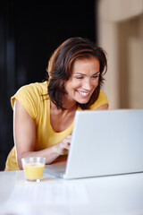Fototapeta premium Woman, typing and laptop in home for remote work, writing email and planning schedule for freelance. Female person, computer and internet research for copywriting career, editing article and smile