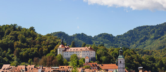 Obraz premium Travel to Skofja Loka to explore its old town filled with historic architecture and charming streets perfect for cultural tourism.