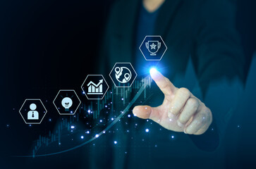 Business strategy concept: Hand interacting with a virtual interface showing an upward trend, innovation, and trophy icons representing market success.