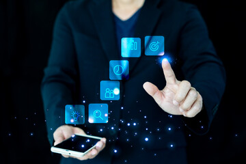 Business strategy concept: Hand interacting with a virtual interface showing an upward trend, innovation, and trophy icons representing market success.