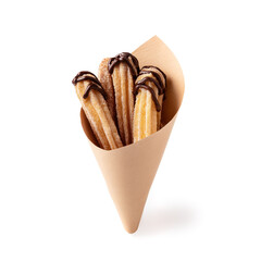 Churros with chocolate sauce in a paper cone - isolated on a white background