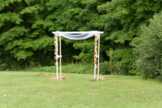 Simple Wedding Arch in Front of Trees