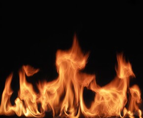Intense orange fire flames burning against a dark black background