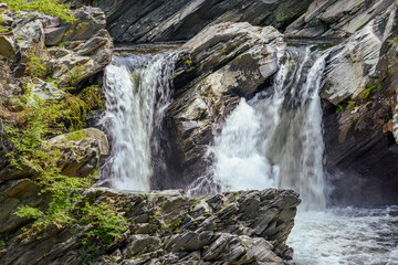 Fototapeta premium Twin cascading waterfalls in the forest
