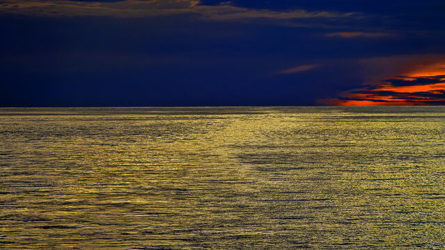 Sunset at the equator, Bali Sea, Sunset reflection on water. Indonesia. Indian Ocean, Spice Islands, A picture against the light