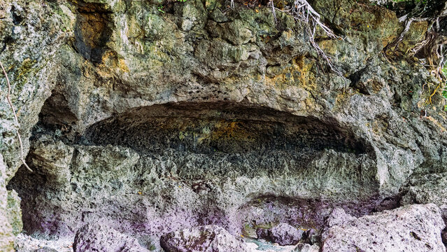 Volcanic island and grotto; grot caves in calcareous rocks and calcareous white sediment. Spice Islands and the Banda Sea