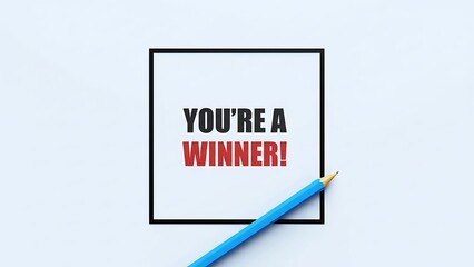 A bright blue pencil pointing towards a black square containing bold red and black text that reads 'YOU'RE A WINNER!' on a clean white background.