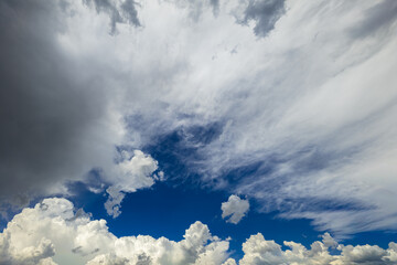 Dynamic clouds fill the sky, creating a moody atmosphere in nature. Awe-inspiring scene captures the beauty of changing weather outdoors.