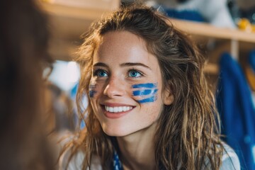 Female fan painting stripes on cheeks before game