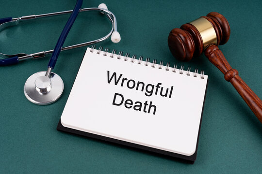 High angle view of Gavel and Wrongful Death text on a Notebook