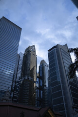Fototapeta premium SINGAPORE - DECEMBER 24, 2025: Modern office buildings and corporate skyscrapers in the Central Business District (CBD) financial zone near Raffles Place.