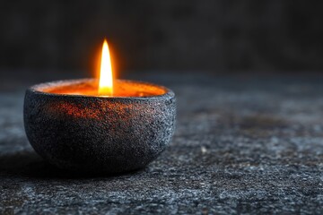 Single candle flame flickering in a dark setting, placed on a polished granite surface with reflections, creating a serene and tranquil atmosphere for relaxation or meditation