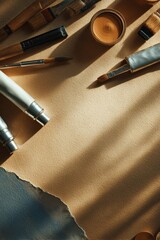 Art tools and materials arranged on a table with shadows in a creative workspace