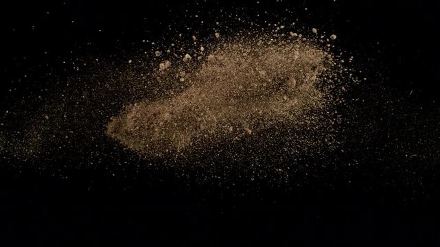 Super Slow Motion of Soil Colliding with Each Other Isolated on Black at 1000fps.