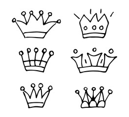 A hand-drawn vector set with a black outline. Various crowns, royal symbol, king and queen, emperor. Ink sketch, drawing.