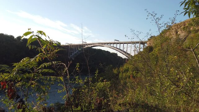 The Niagara River and the Queenston&ndash;Lewiston Bridge, a border crossing between the United States and Canada, shot in time lapse during late afternoon.