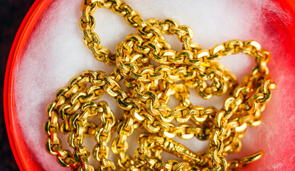 Pile of Gold Chain Necklaces on white surface