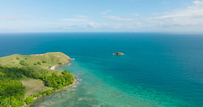 Coastline with ocean waves and tropical coral reefs. Cabangajan. Santa Fe, Tablas, Romblon. Philippines.