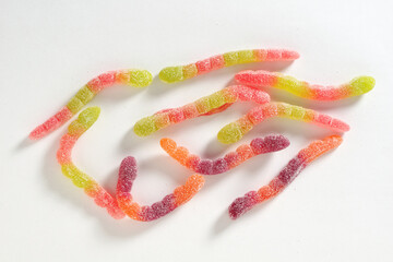 Gummy worms candy on white