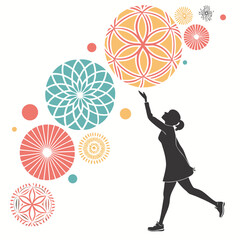 Silhouette of a woman reaching for colorful mandalas