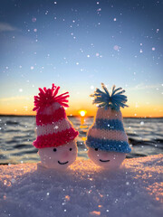 couple of snowman hats at the frozen beach