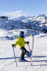 Obraz premium Happy family in winter clothing at the ski resort, winter time