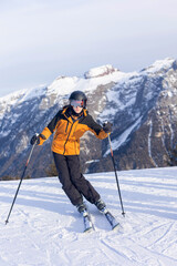 Happy family in winter clothing at the ski resort, winter time