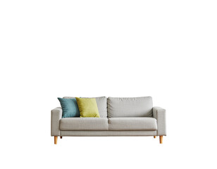 Cream sofa with light wood legs and colorful throw pillows in a bright living room setting