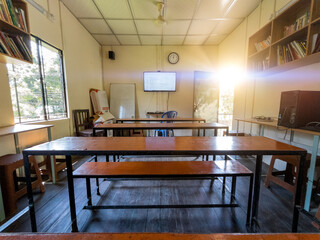 Smart Classroom with Digital Screen and Traditional Wooden Benches in Rural Bangladesh