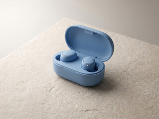 Modern blue wireless earbuds with charging case on a textured surface