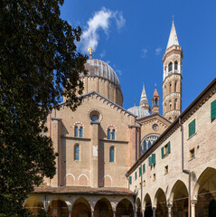The exterior view of the Basilica of Saint Anthony in Padua, Italy, showing its Gothic architecture, including bell towers and arches.