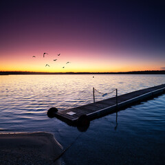 beautiful wooden pier over the water at the beach